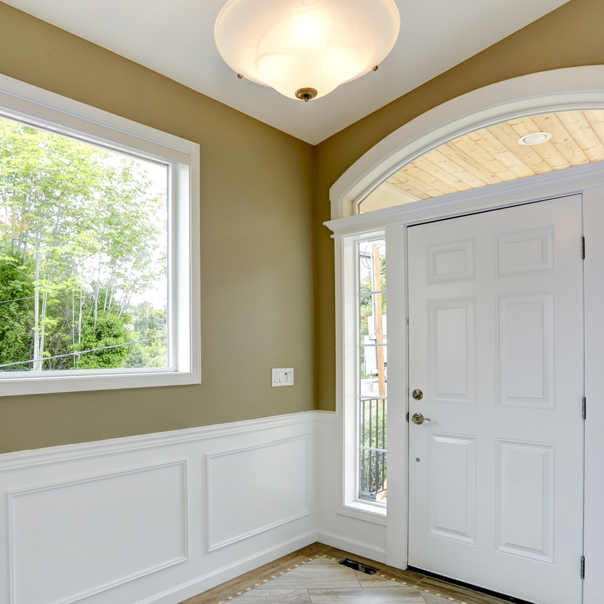 Chair Rail used in an entryway of a home with a 6 panel exterior door