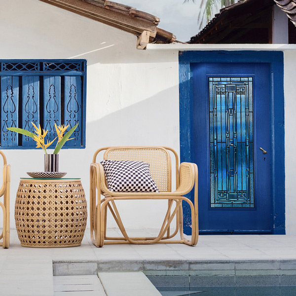 Traditional style home back porch with a full lite blue door