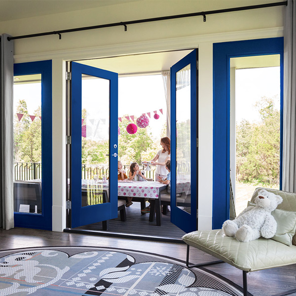 Traditional style den view of back patio with full lite blue Vista Grande double doors