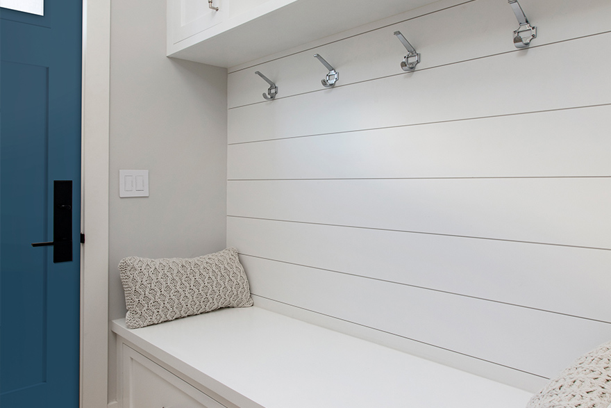 Entryway to a Modern Coastal style home with white shiplap on the walls