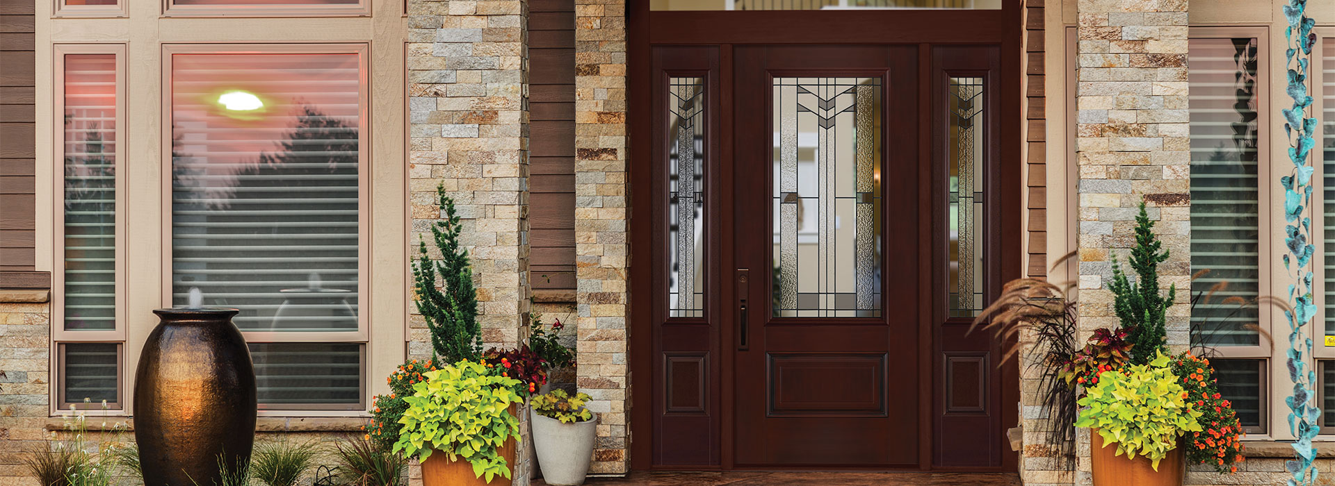 Traditional style front of home with a 3/4 lite 1 panel Bellville door and matching sidelites