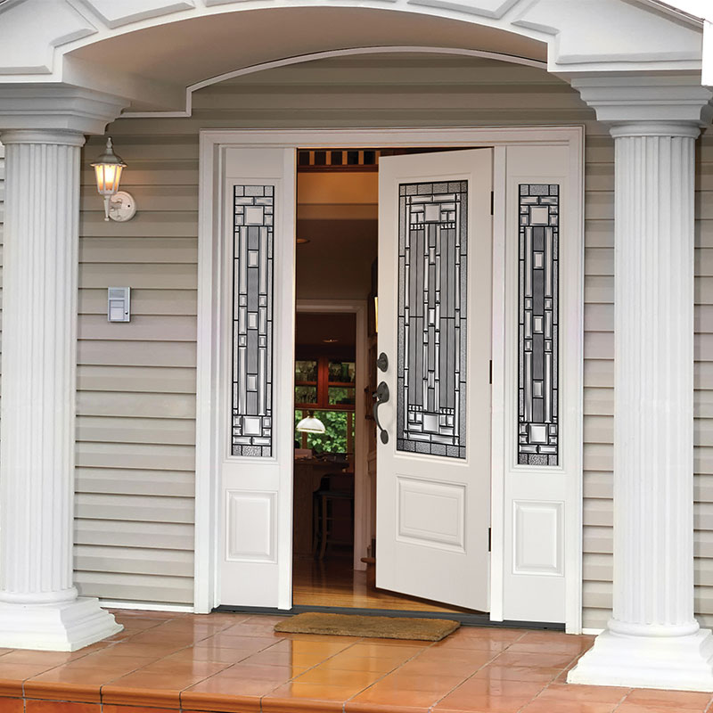 Colonial style front of home with a 3/4 lite 1 panel white door and matching sidelites with Naples glass