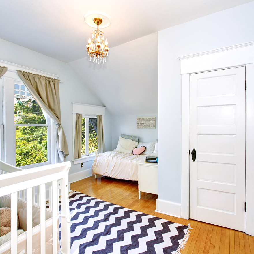 Baby bedroom with door casing and baseboard moulding