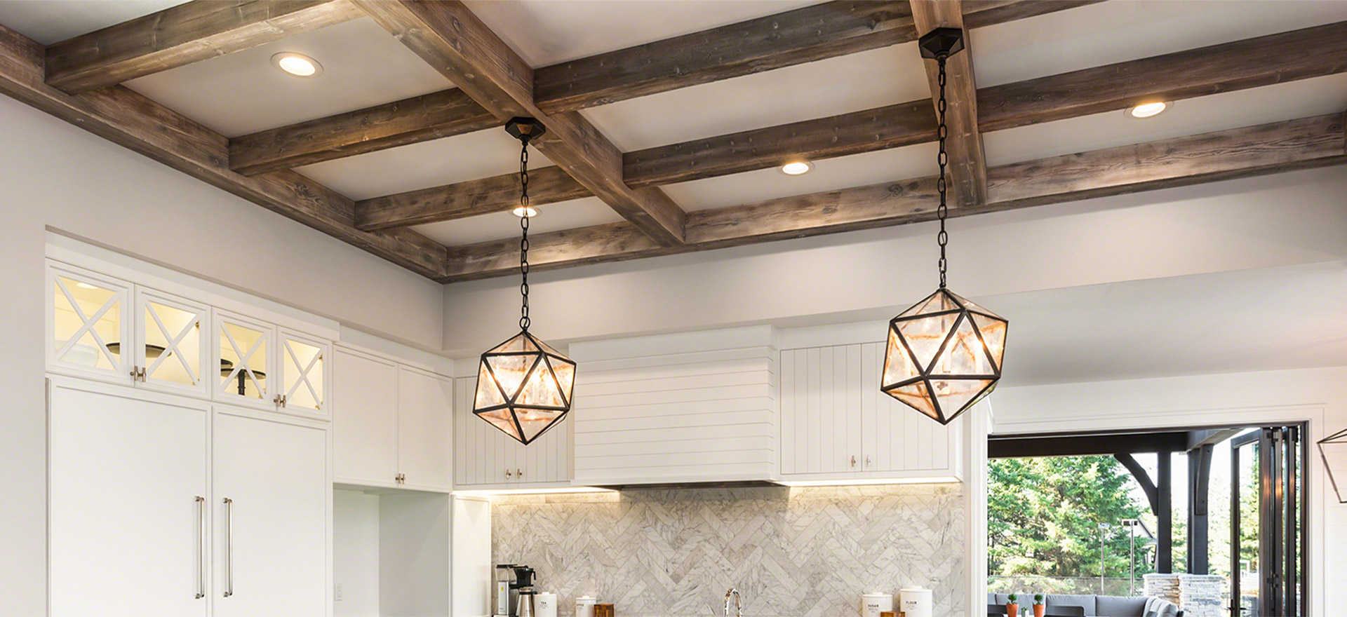 Polyurethane beams and 2 geometric lights in a kitchen ceiling