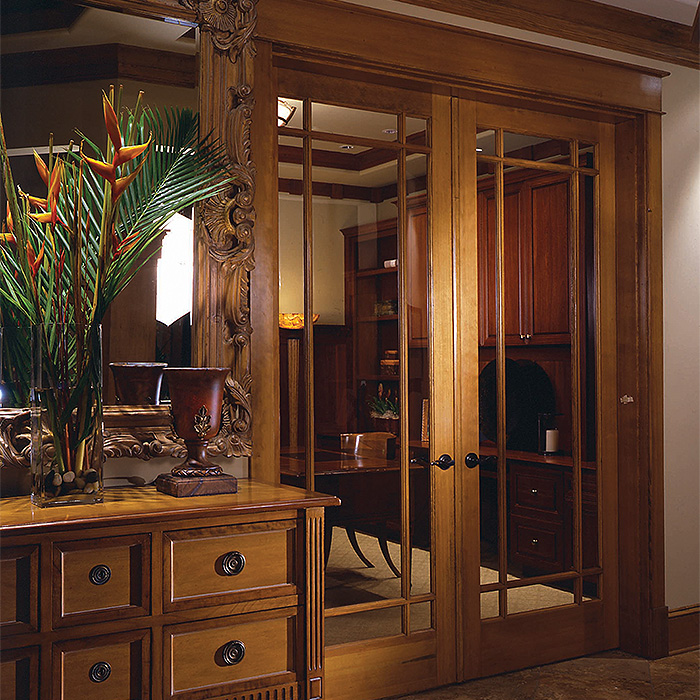 Traditional style home den using Simpson interior French full lite double doors