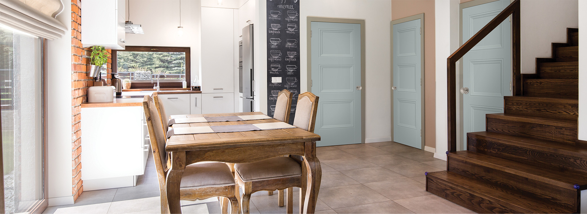 3 interior 3 panel Livingston doors in a modern farmhouse style kitchen with dining table