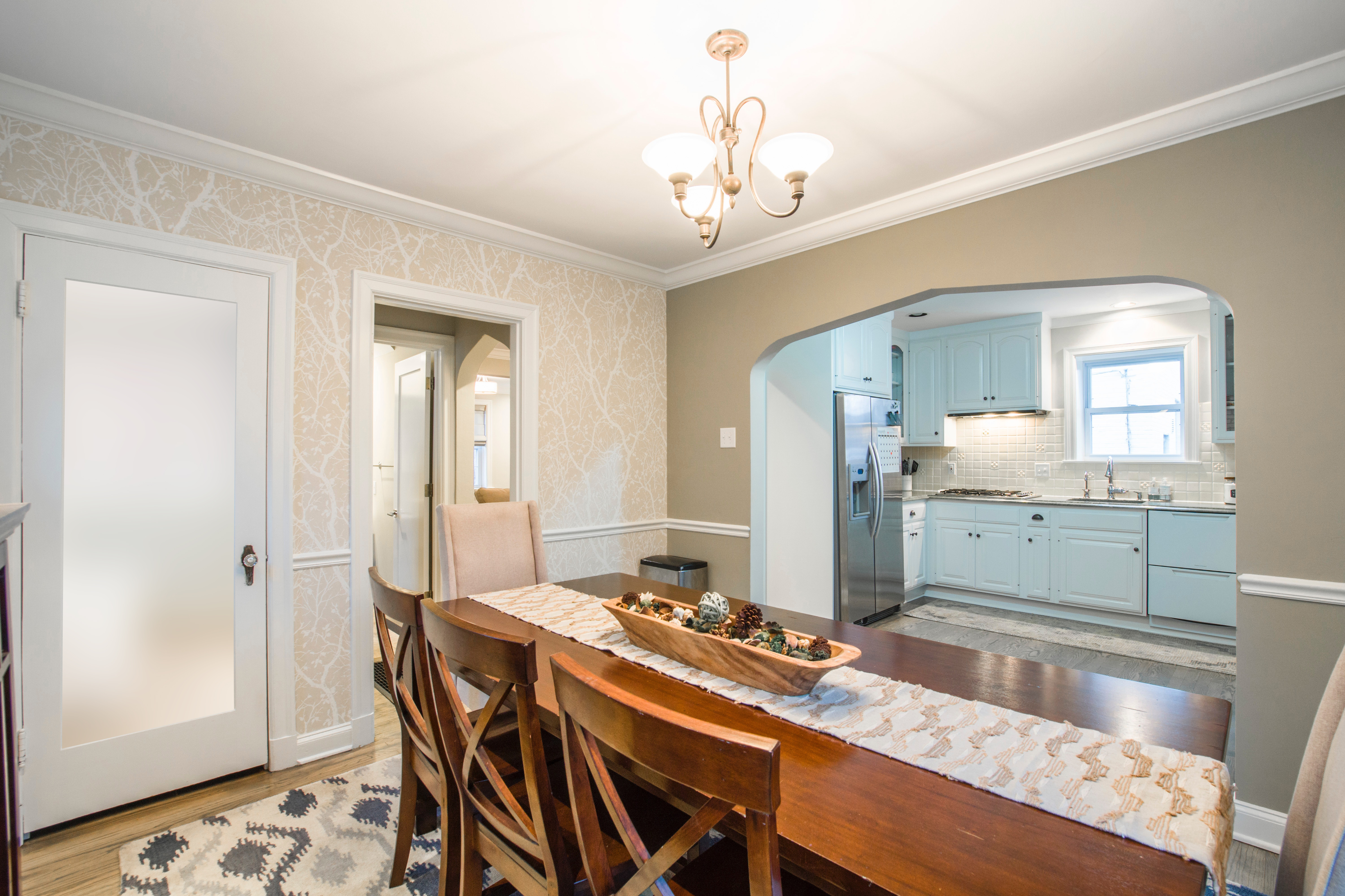 Moulded panel Lami full Lite interior Door in a Transitional style dining room and kitchen