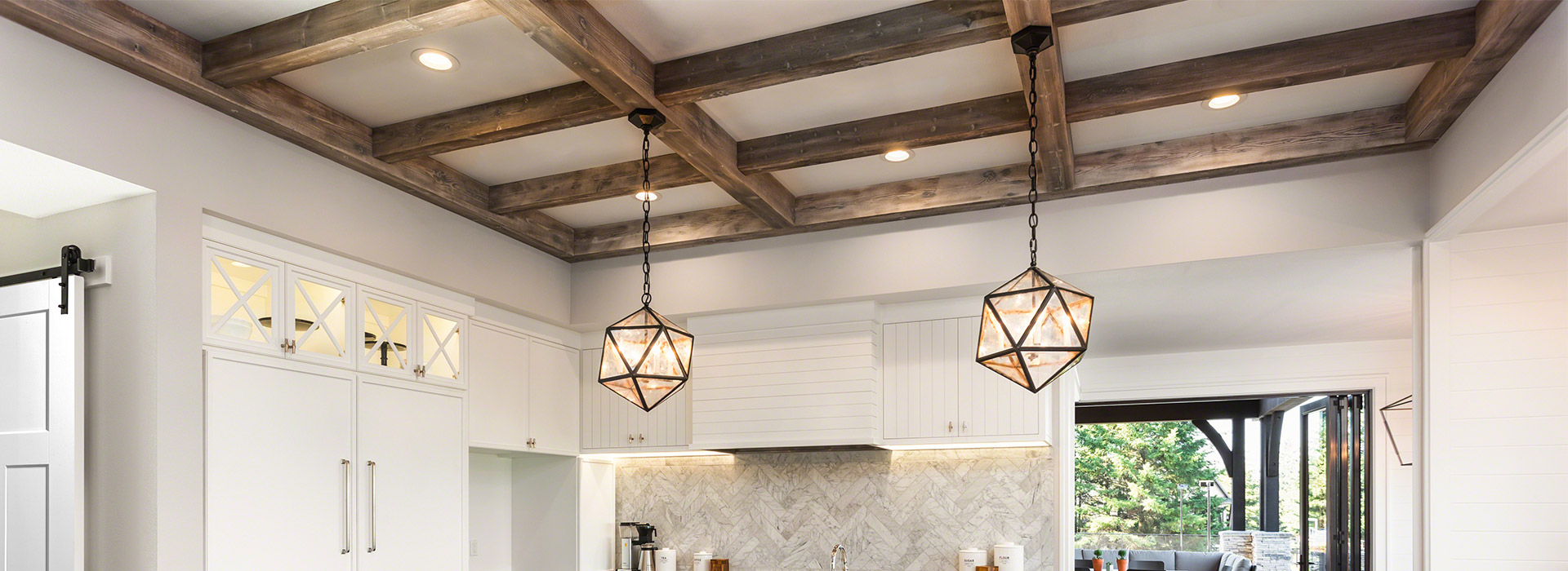 Fypon Polyurethane beams and 2 geometric lights in a kitchen ceiling