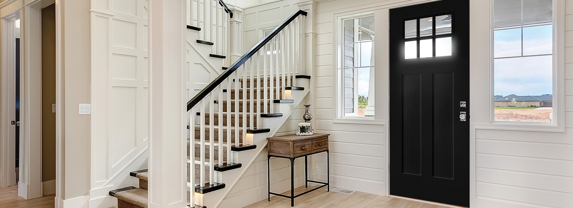 Craftsman style home interior entryway with Heritage Craftsmen Series 6 lite 2 panel door