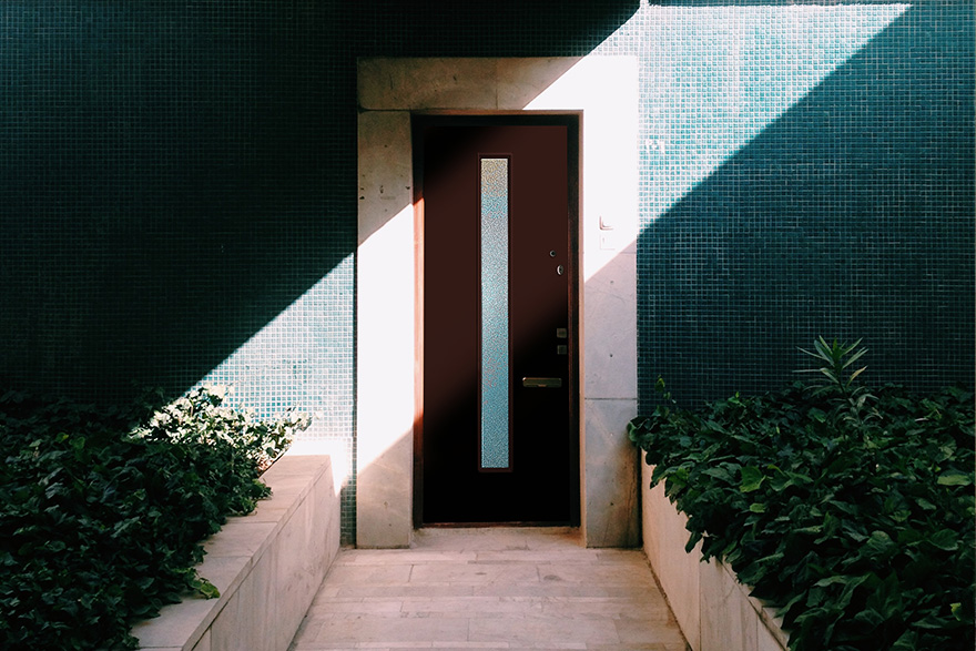 Modern home front with modern 1 lite brown front door