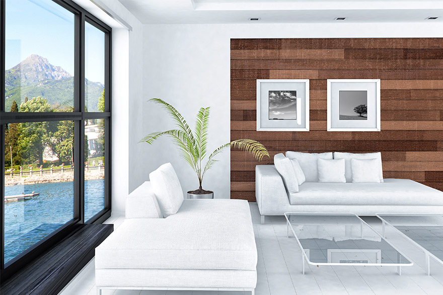 Asian style living room with a water and mountain window view to the left, back wood accent wall, 2 white couches, 2 clear glass coffee tables, and a house plant in the corner