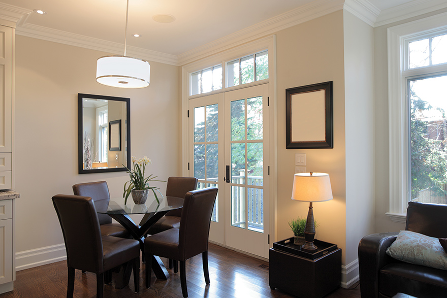 Traditional style dining room with white Vistagrande double doors with Sdl Bars 